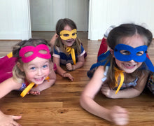 Load image into Gallery viewer, Girls in superhero costumes crawling on floor
