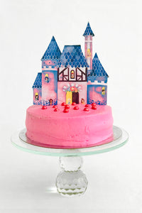 Princess cake topper on a pink princess cake