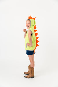 Green dinosaur vest with orange spikes on a child