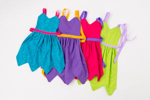 Child aprons in blue, purple, pink, and green