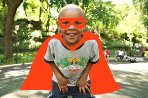 Superhero boy with red cape and mask