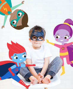 Boy in Batman mask, with superhero graphics