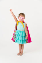 Load image into Gallery viewer, Child wearing a superhero cape with a white background