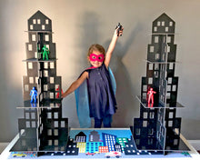 Load image into Gallery viewer, Girl in superhero costume playing with superhero toys
